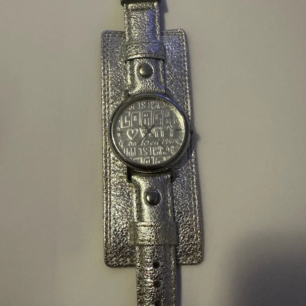 Coach Poppy cuff watch. Genuine leather with silver metallic‎ design. Vintage